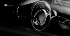 DWI vs. DUI in Texas blog image showing a car steering wheel interior for Spiegelhauer Law