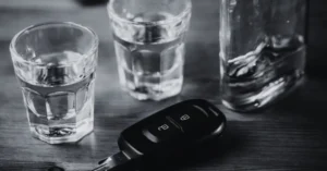 Summer DWI enforcement in College Station with alcohol glasses and car keys