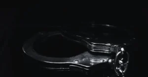 Handcuffs representing delayed criminal charges in Texas