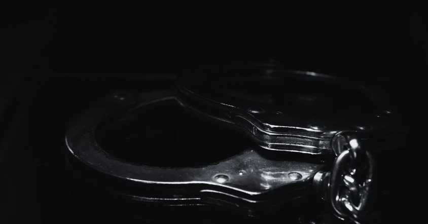 Handcuffs representing delayed criminal charges in Texas